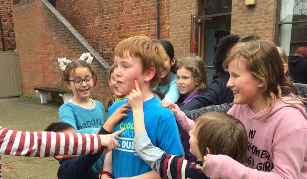 Elfins playing a game in a yard