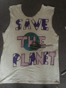 The arms and neck of the old shirt are cut out to make room to carry the bag 