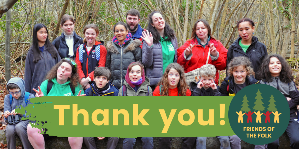 Image of a group of children and volunteers sitting in a wood, with the words "Thank you" underneath them and the Friends of the Folk logo